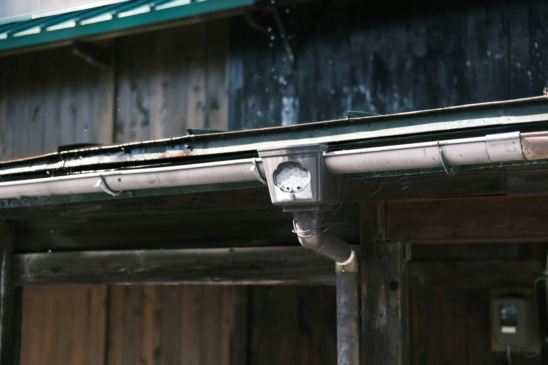 a close up of a metal pipe on a building